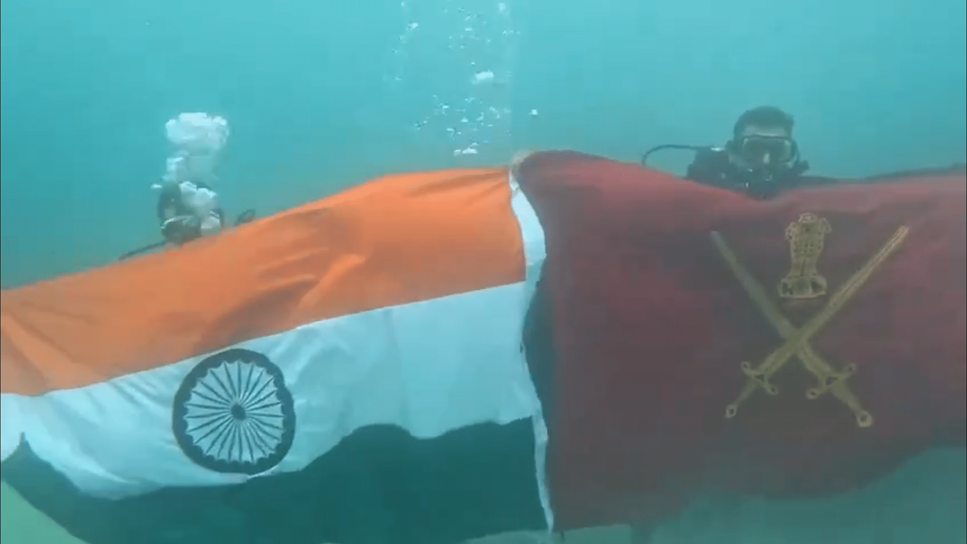 <div class="paragraphs"><p>Screengrab showing the Tricolour hoisted under-water</p></div>