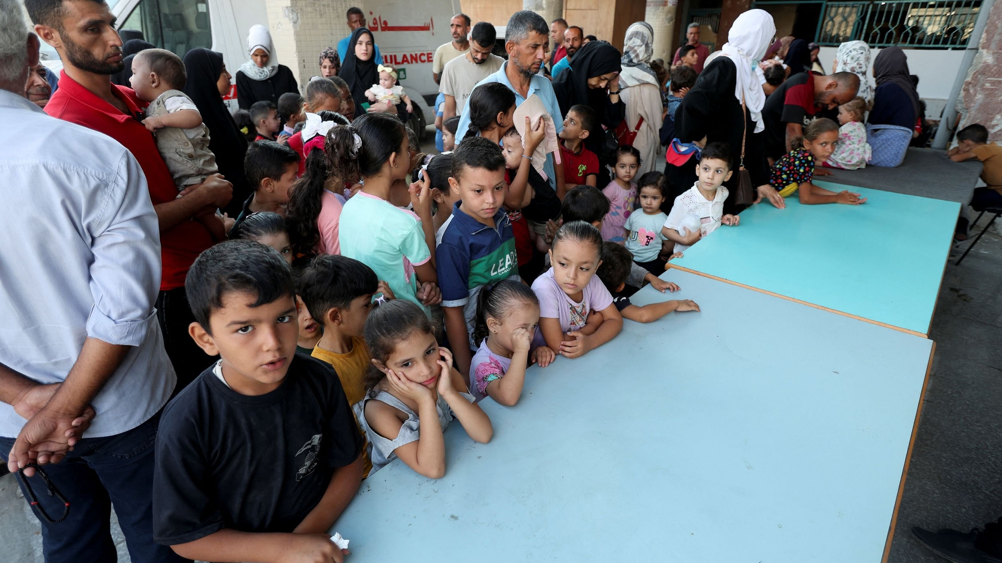 <div class="paragraphs"><p>Palestinian children wait to be vaccinated against polio, at a United Nations healthcare center in Deir Al-Balah in the central Gaza Strip</p></div>