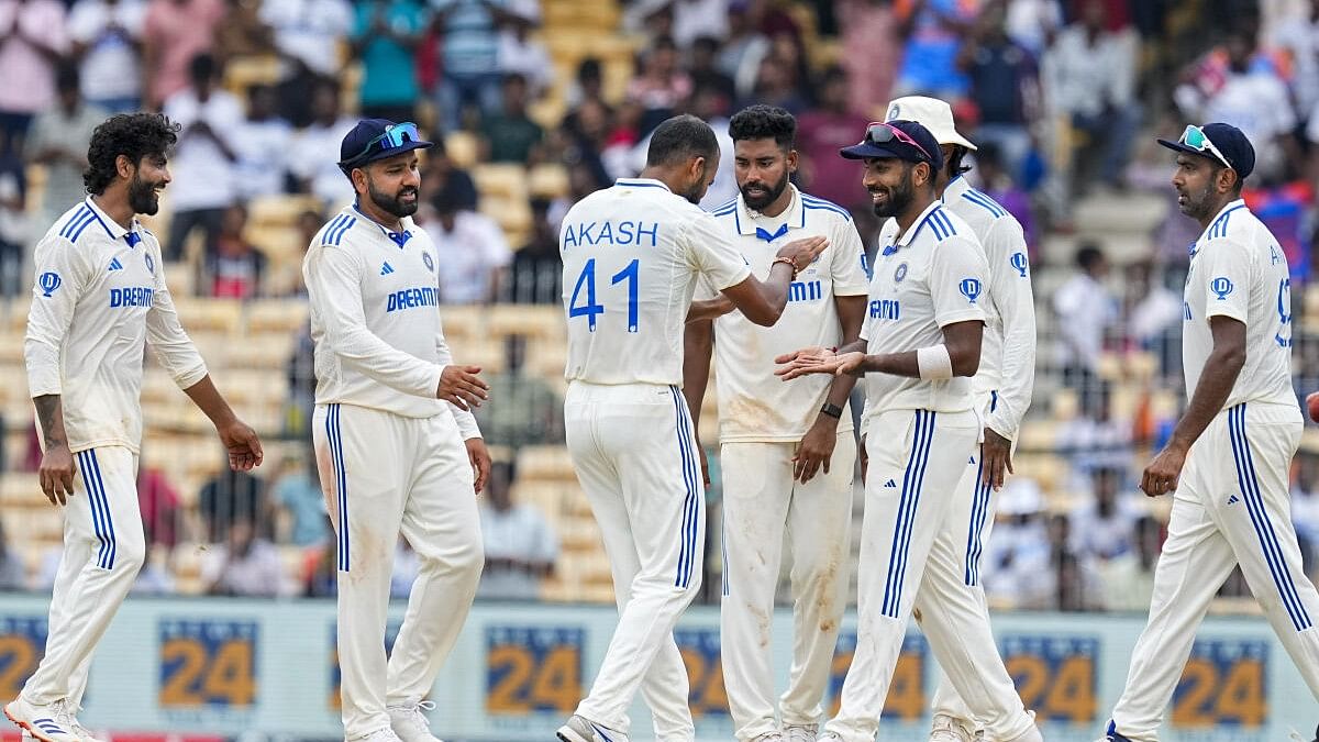 <div class="paragraphs"><p> Ravindra Jadeja with teammates celebrates the dismissal of Bangladesh's Najmul Hossain Shanto on the fourth day of the first Test cricket match between India and Bangladesh, at MA Chidambaram Stadium in Chennai.</p></div>