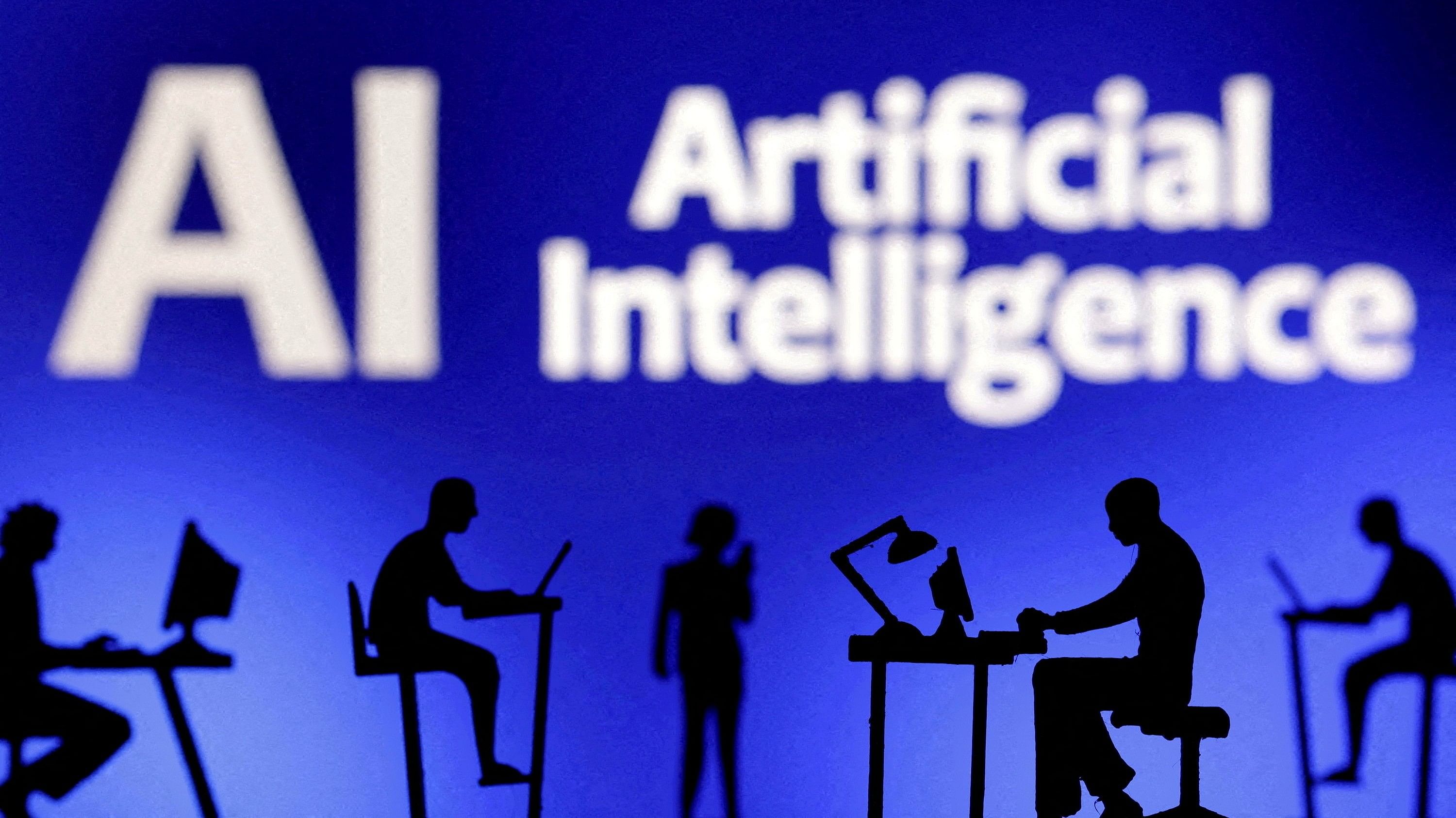 <div class="paragraphs"><p>Figurines with computers and smartphones are seen in front of the words 'Artificial Intelligence AI'.</p></div>