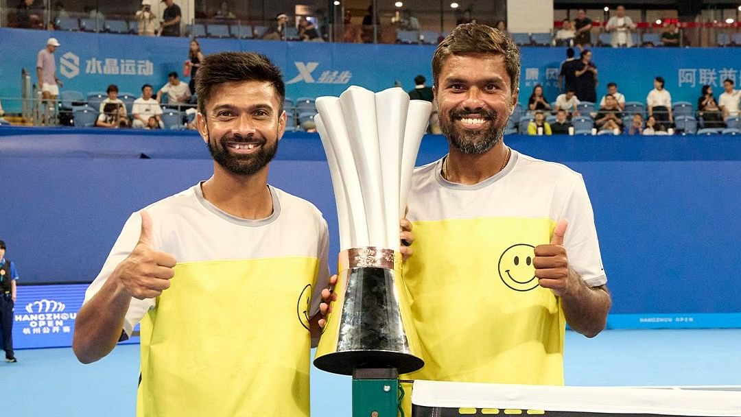 <div class="paragraphs"><p>Jeevan Nedunchezhiyan (left) and Vijay Sundar Prashanth are all smiles as they pose with the spoils.&nbsp;</p></div>