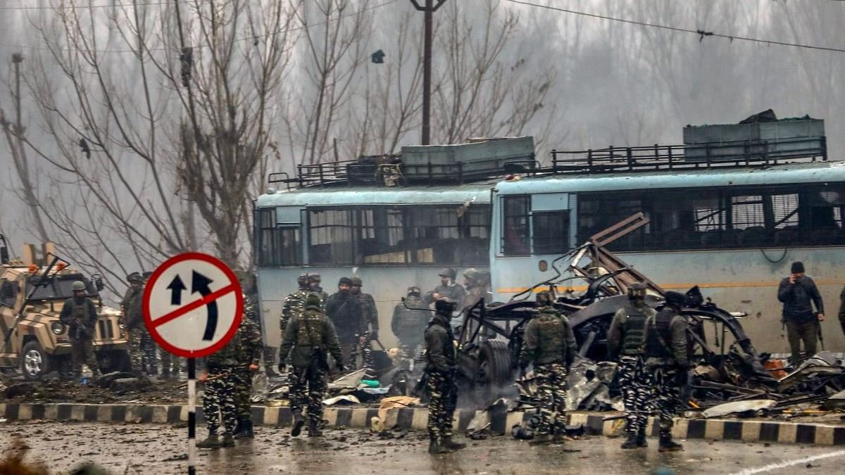 <div class="paragraphs"><p>Security personnel carry out the rescue and relief work at the site of a suicide bomb attack at Lathepora Awantipora in Pulwama district of south Kashmir.</p></div>