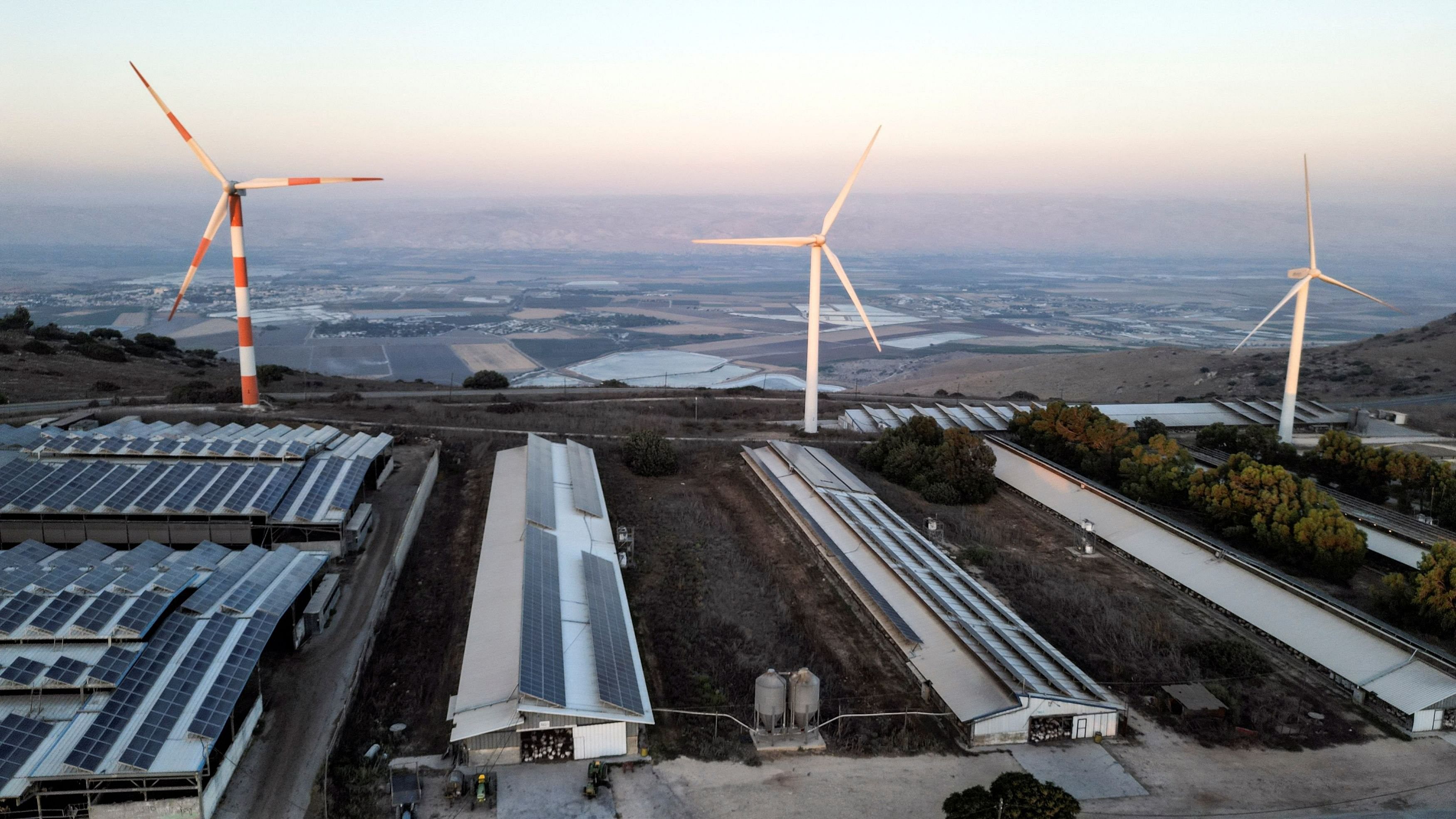 <div class="paragraphs"><p>Representative image of wind turbines and solar panels on the rooftops.</p></div>