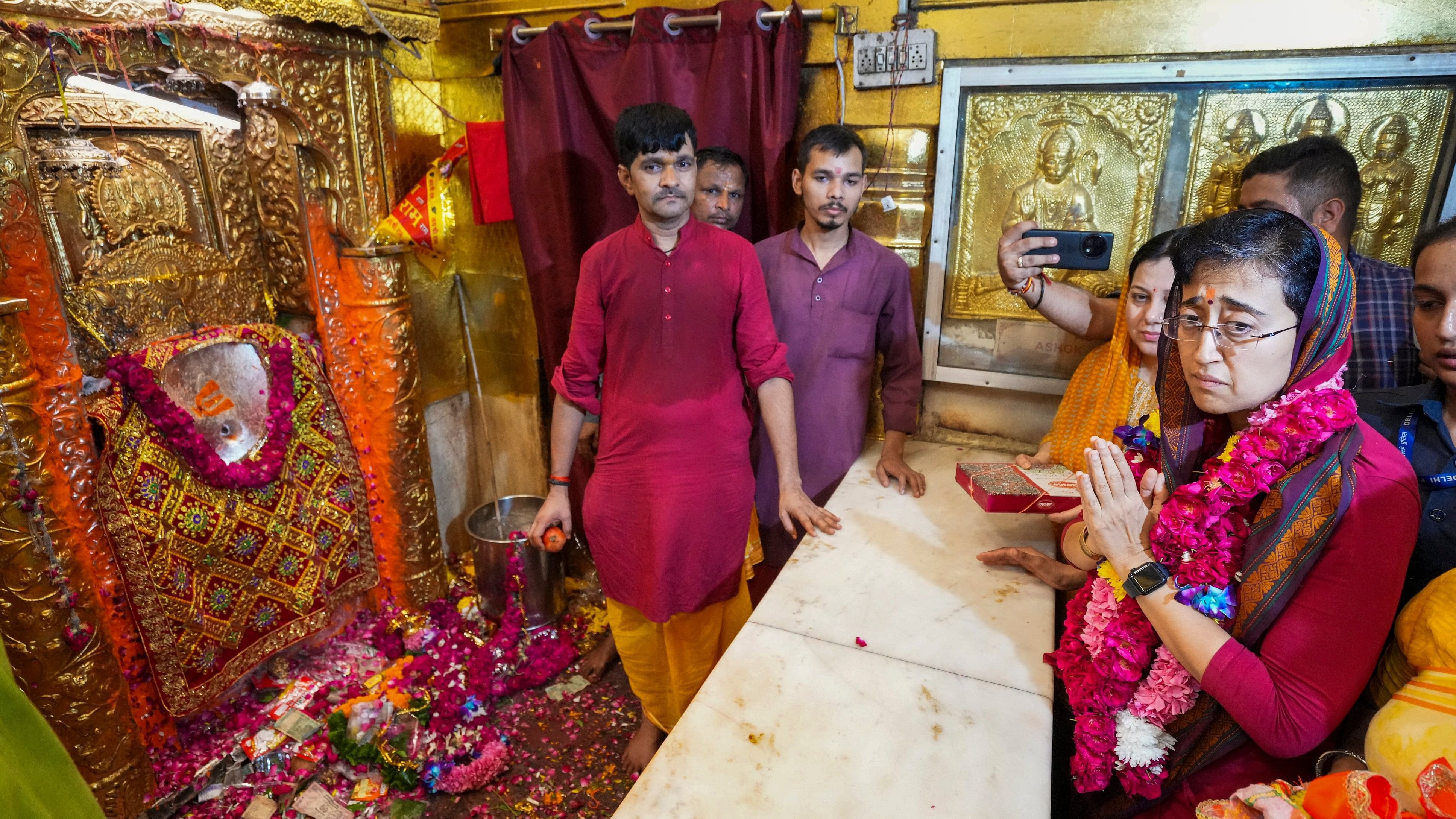 <div class="paragraphs"><p>New Delhi: Delhi Chief Minister Atishi during her visit at the Hanuman temple at Connaught Place, in New Delhi, Tuesday, Sept. 24, 2024. </p></div>