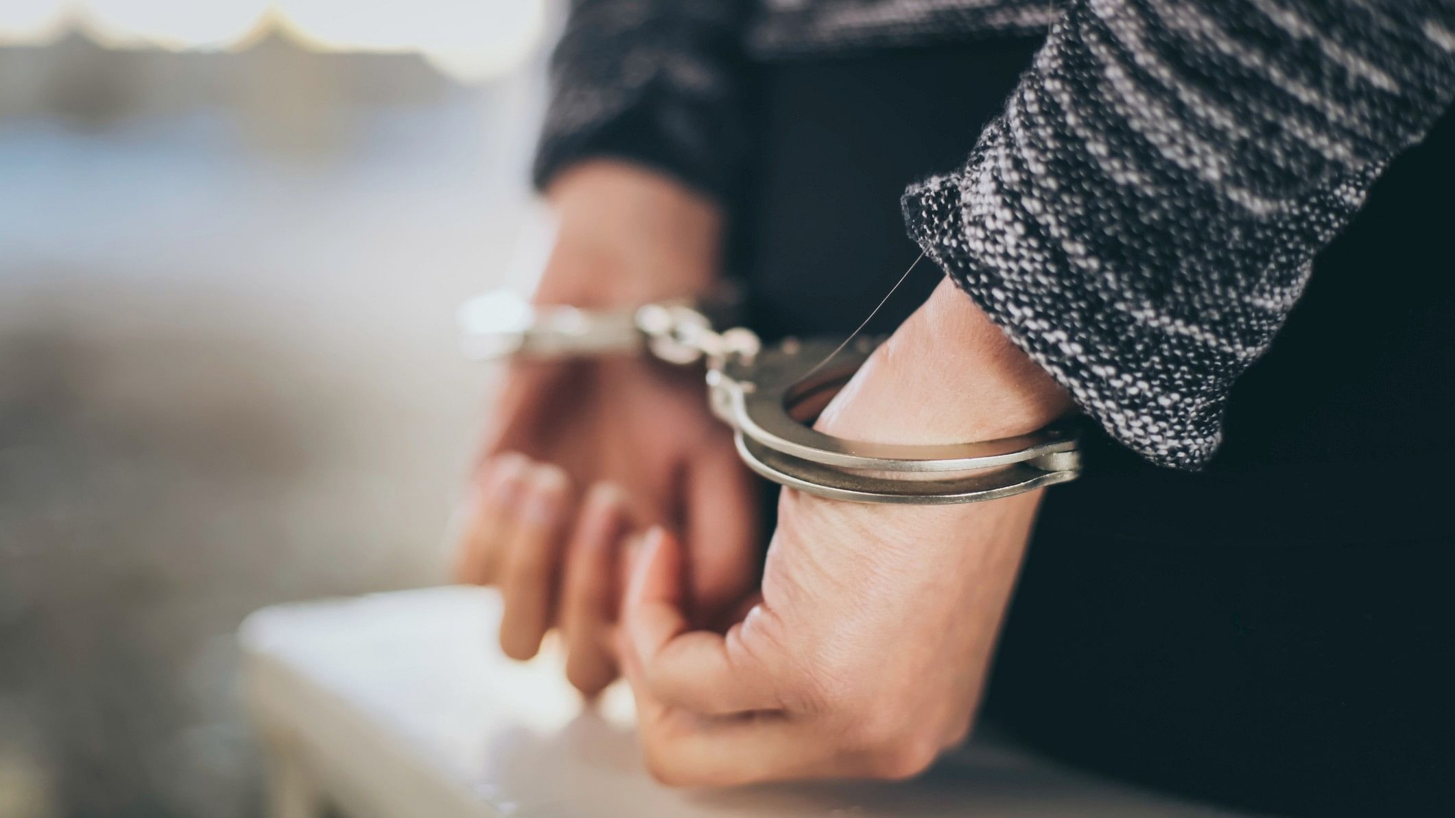 <div class="paragraphs"><p>A representative image showing a woman handcuffed.</p></div>