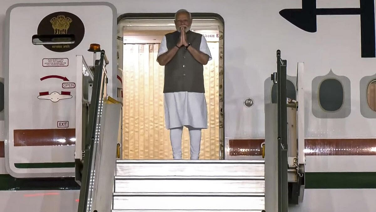 <div class="paragraphs"><p> Prime Minister Narendra Modi gestures upon his arrival in New Delhi after completing his US visit, Tuesday, September 24, 2024.</p></div>