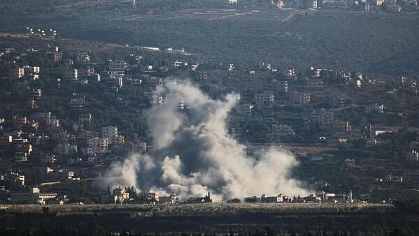 <div class="paragraphs"><p>Smoke billows over southern Lebanon following an Israeli strike, amid ongoing cross-border hostilities between Hezbollah and Israeli forces, as seen from Tyre, Lebanon September 25, 2024. </p></div>