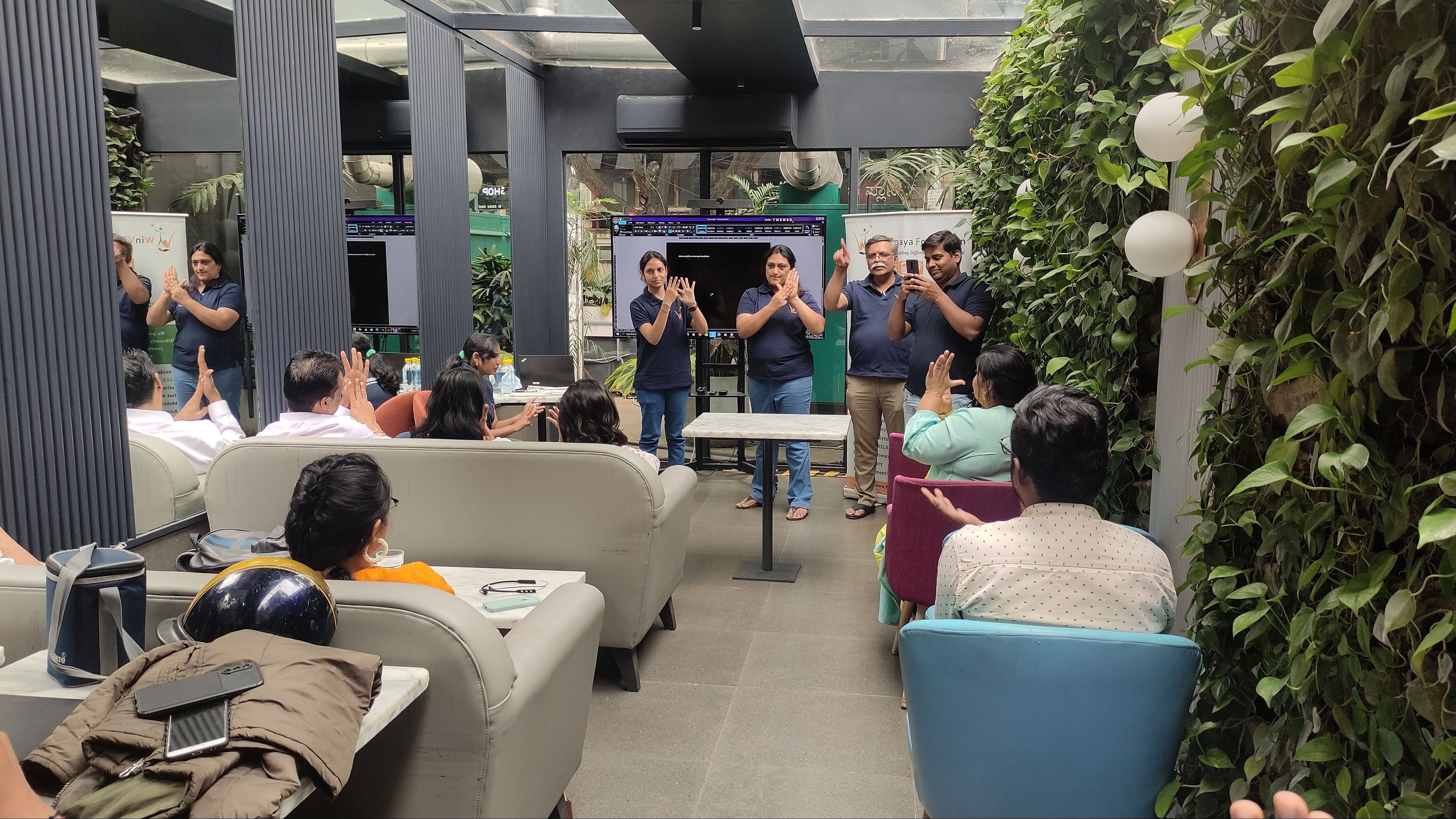 Volunteers of WinVinaya at a sign language training session at a corporate company in Bengaluru.