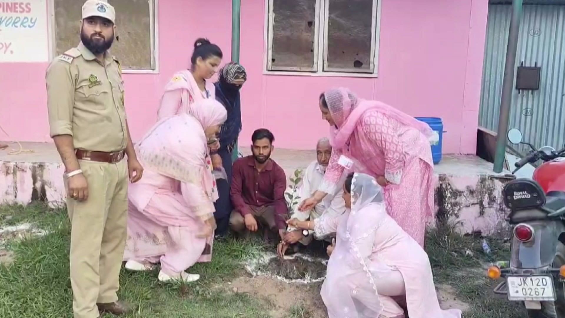 <div class="paragraphs"><p>Akbar Khan planting a sapling before going for voting.&nbsp;</p></div>