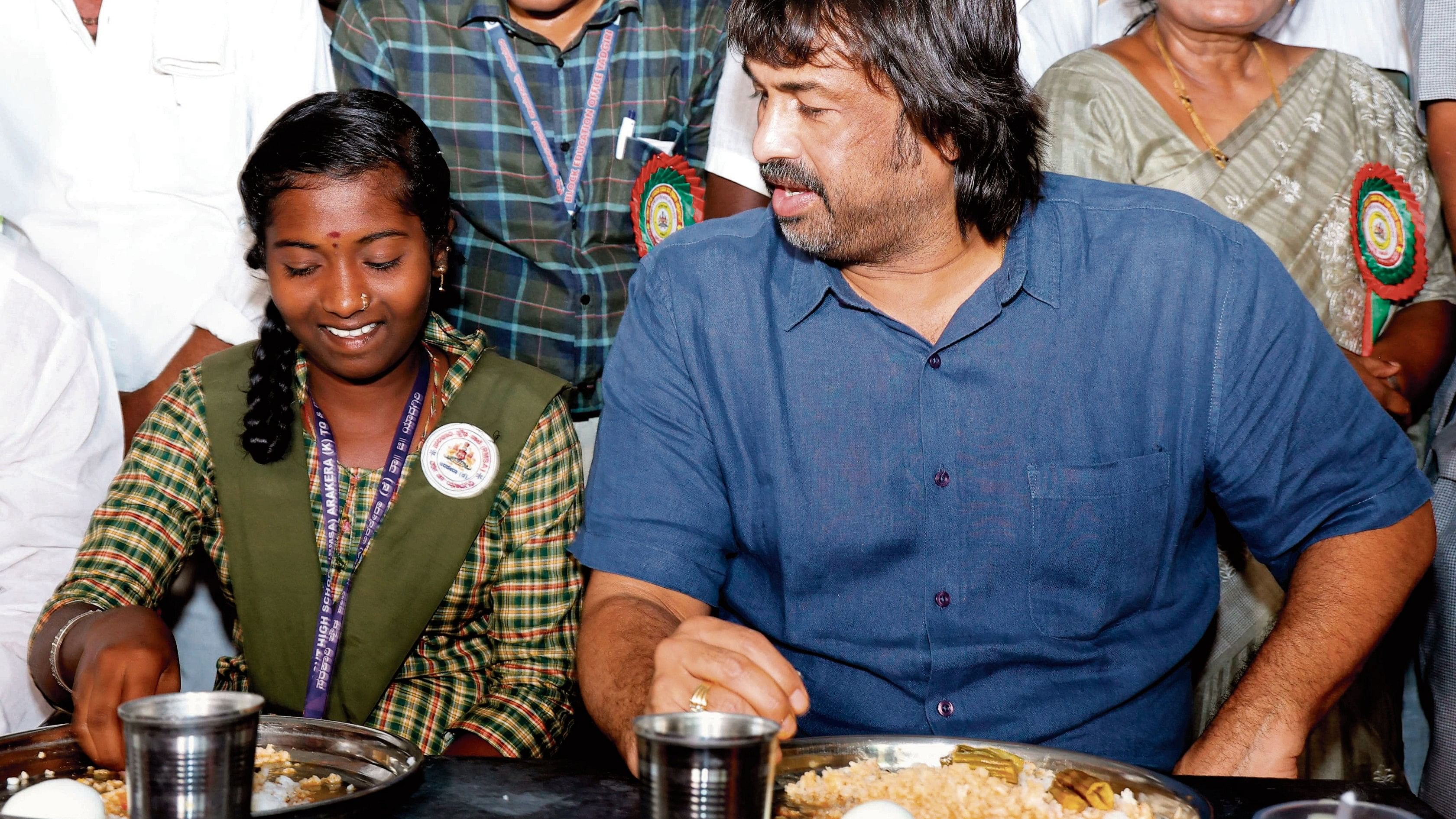 <div class="paragraphs"><p>School Education and Literacy Minister Madhu Bangarappa has midday meal with students in a school at Arakera village of Yadgir taluk, after launching a drive to distribute six eggs a week to government and aided schoolchildren, on Wednesday.</p></div>