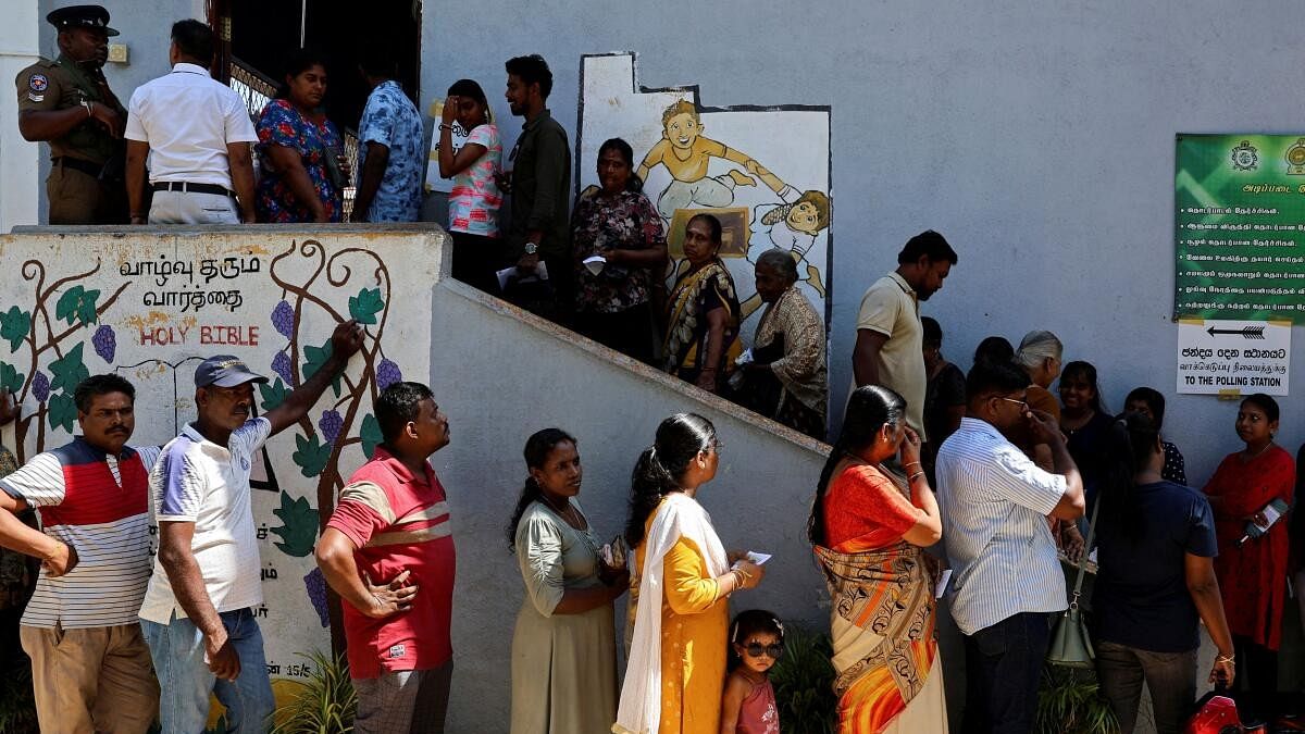 <div class="paragraphs"><p>Voters queue outside a polling station to vote on the day of the presidential election, in Colombo, Sri Lanka.</p></div>