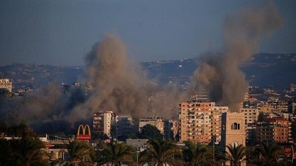 <div class="paragraphs"><p>Smoke billows over southern Lebanon following an Israeli strike, amid ongoing cross-border hostilities between Hezbollah and Israeli forces, as seen from Tyre, Lebanon.</p></div>