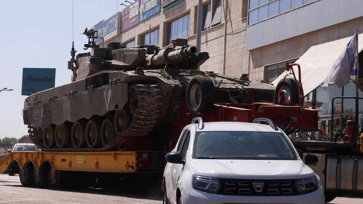 <div class="paragraphs"><p>An Israeli army tank is transported, amid cross-border hostilities between Hezbollah and Israel.</p></div>