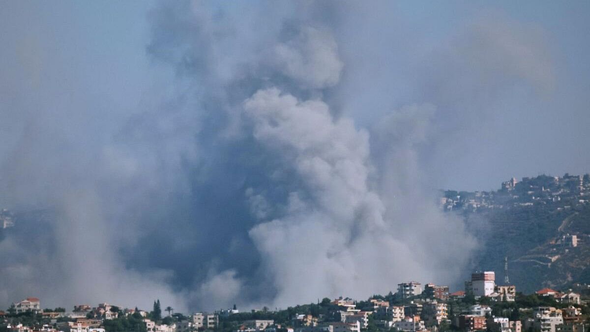 <div class="paragraphs"><p>Smoke billows over southern Lebanon following an Israeli strike, amid ongoing cross-border hostilities between Hezbollah and Israeli forces.</p></div>