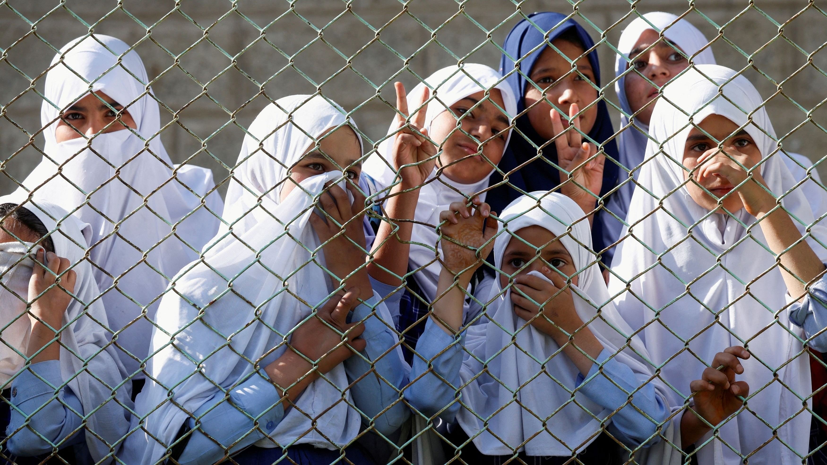 <div class="paragraphs"><p>Kashmiri schoolgirls gesture while listening during a rally in North Kashmir's Kupwara district, September 17, 2024.</p></div>