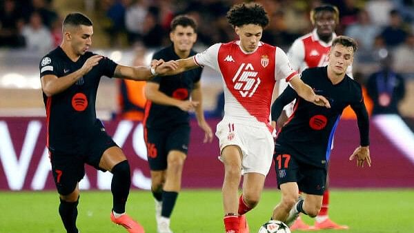 <div class="paragraphs"><p>FC Barcelona's Ferran Torres and Marc Casado in action with AS Monaco's Maghnes Akliouche</p></div>