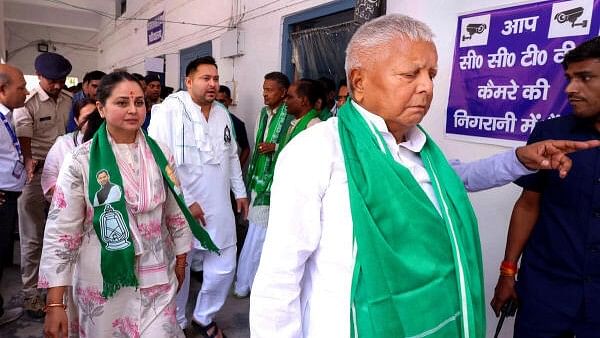 <div class="paragraphs"><p>RJD chief Lalu Prasad Yadav with his daughter Rohini Acharya.</p></div>