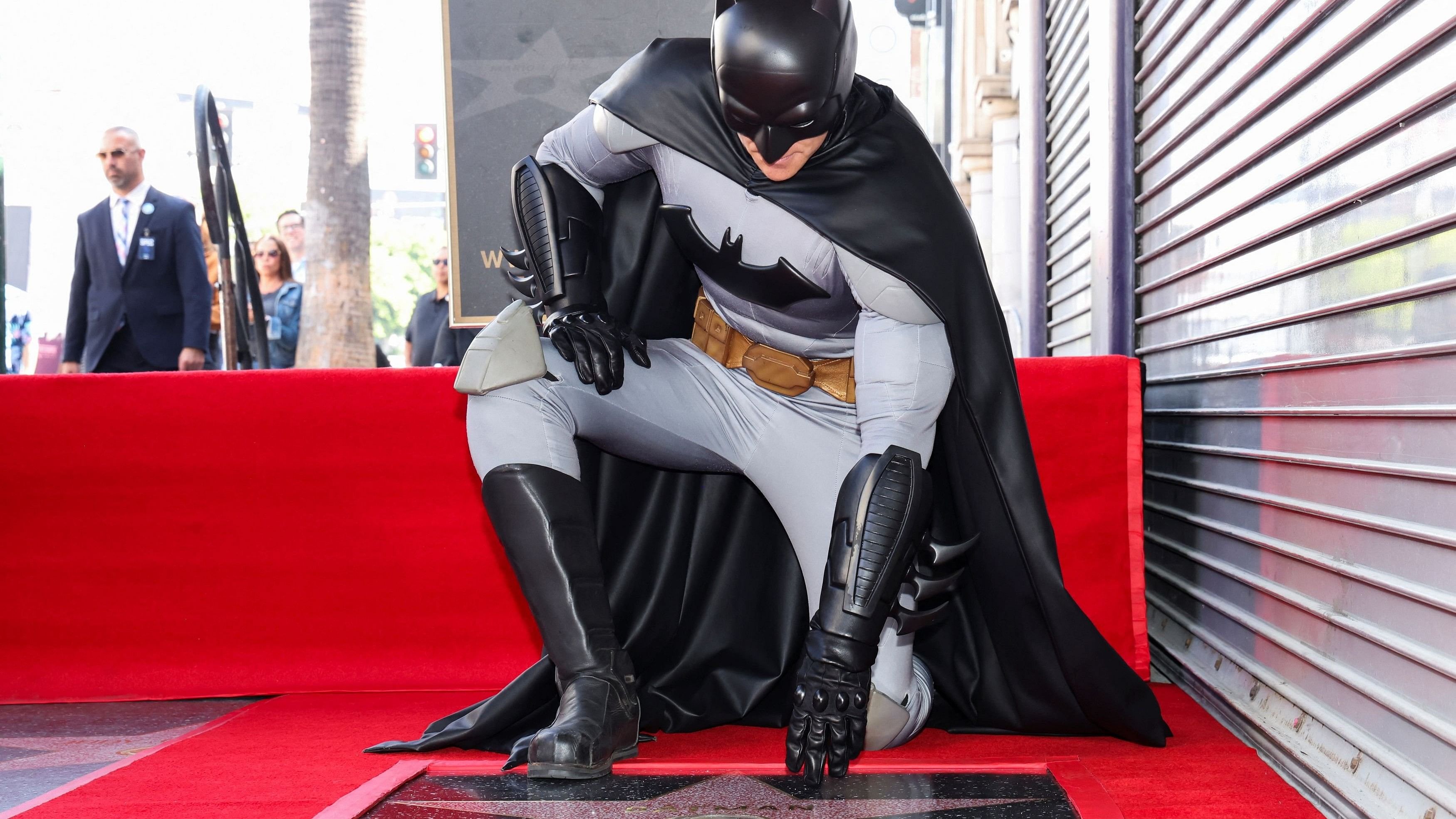 <div class="paragraphs"><p>An actor dressed as Batman poses next to the character's star on the Hollywood Walk of Fame, during the unveiling ceremony, in Los Angeles, California.</p></div>