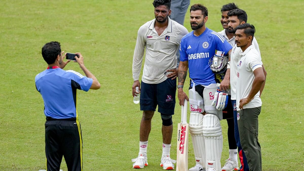 <div class="paragraphs"><p>Virat Kohli with young cricketers during a training session ahead of the 2nd Test cricket match between India and Bangladesh, in Kanpur.&nbsp;</p></div>