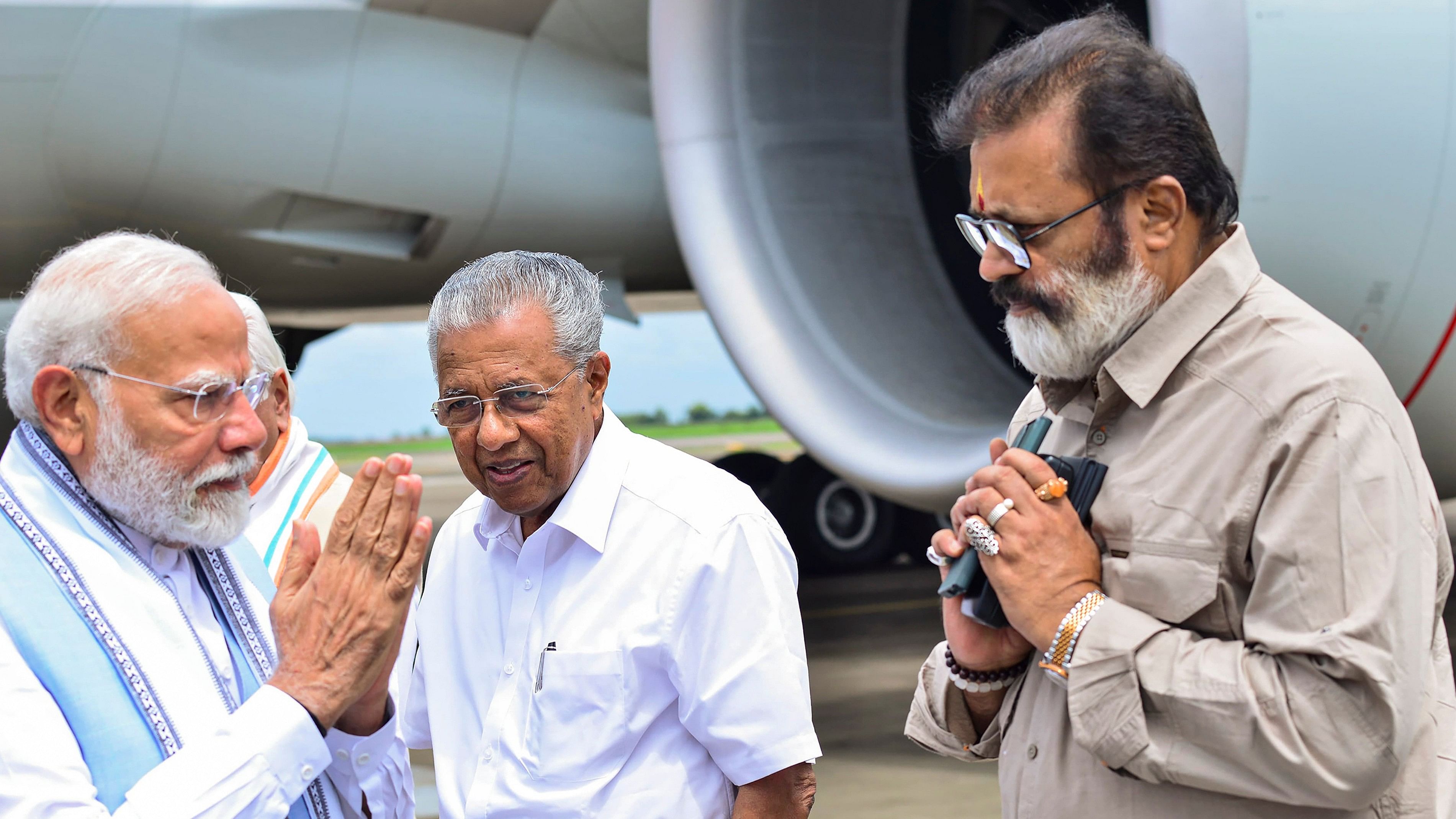 <div class="paragraphs"><p>Prime Minister Narendra Modi with Kerala Chief Minister Pinarayi Vijayan and Union MoS Suresh Gopi.</p></div>