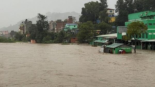 <div class="paragraphs"><p>Flood along the bank of overflowing Bagmati River following heavy rains in Kathmandu.</p></div>