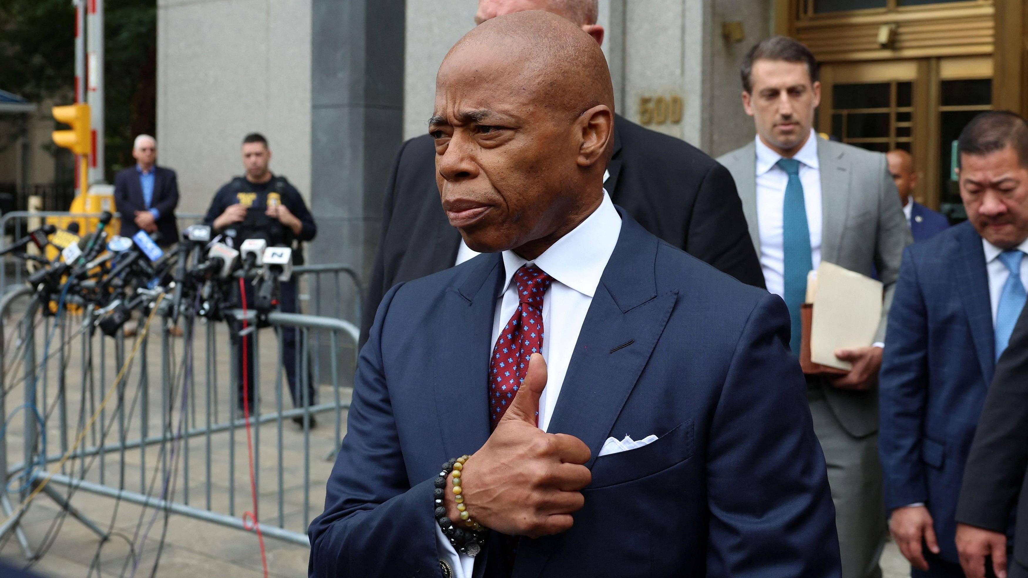 <div class="paragraphs"><p>New York City Mayor Eric Adams gestures outside federal court, on the day of his arraignment after he was charged with bribery and illegally soliciting a campaign contribution from a foreign national, in New York City.</p></div>