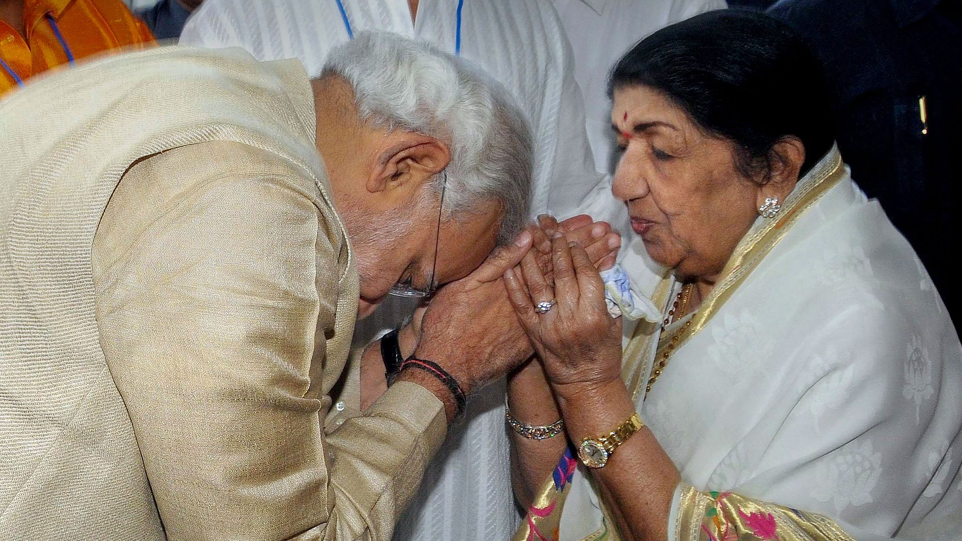 <div class="paragraphs"><p>File image dated, Friday, Nov. 1, 2013, of then Gujarat Chief Minister Narendra Modi with legendary singer Lata Mangeshkar.</p></div>