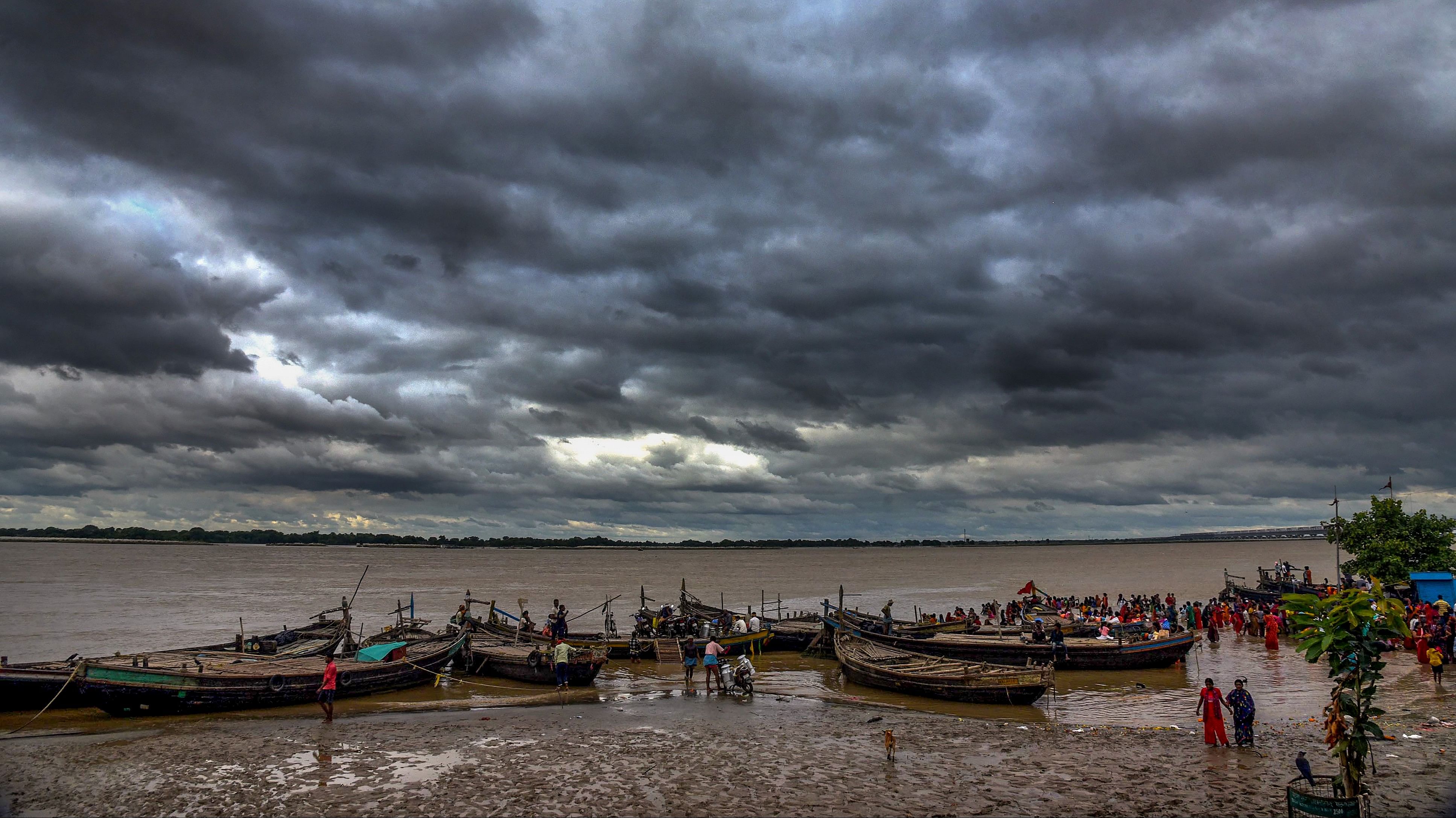 <div class="paragraphs"><p>Dark clouds hover above River Ganga, in Patna.</p></div>