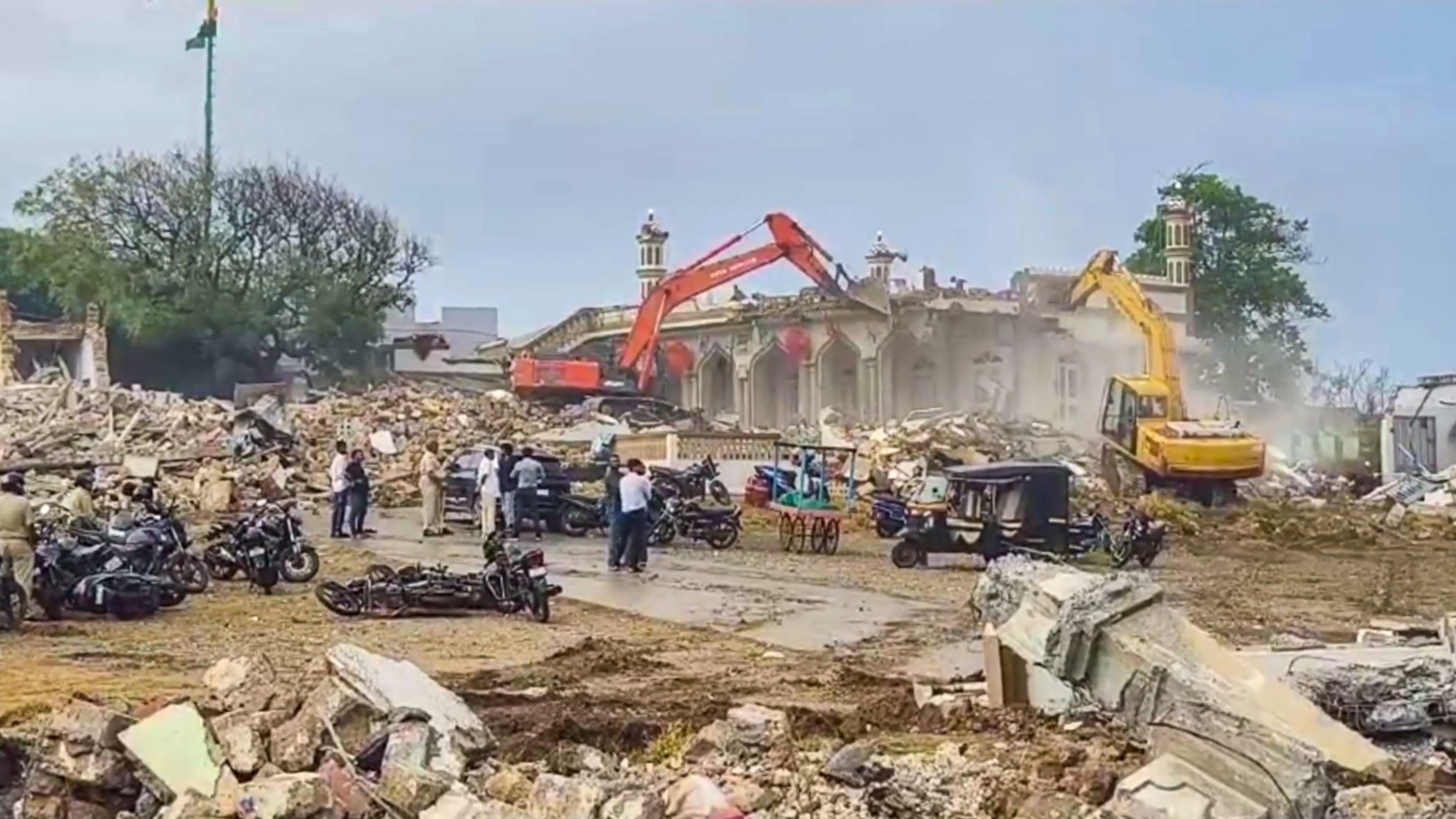 <div class="paragraphs"><p>Excavators being used to demolish illegal settlements near Somnath Temple, in Gir Somnath district, Gujarat, Saturday.</p></div>