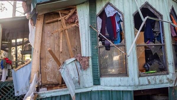 <div class="paragraphs"><p>Clothing hangs out of broken windows of a home after Hurricane Helene made landfall in Steinhatchee, Florida.&nbsp;</p></div>