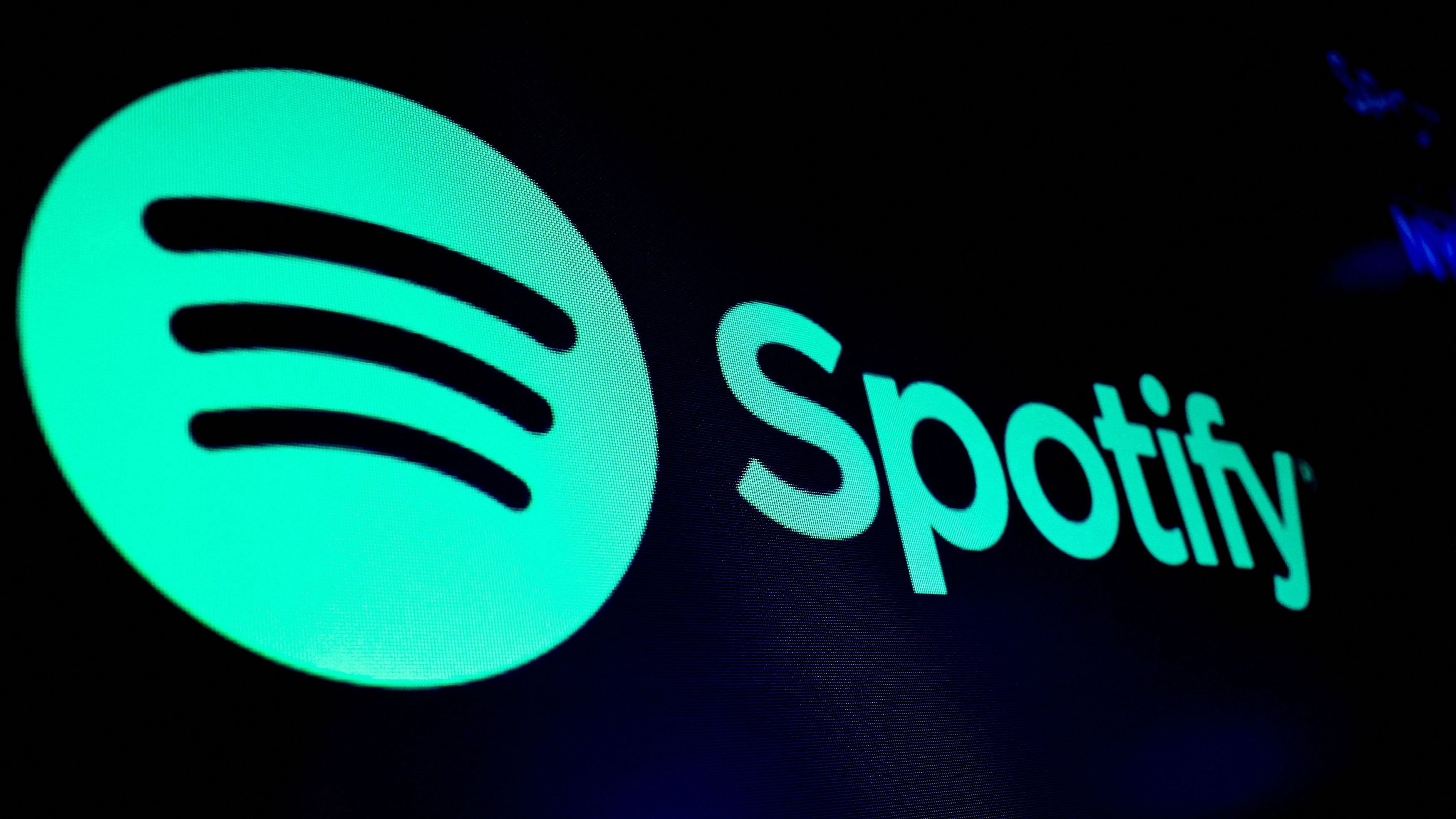 <div class="paragraphs"><p>A screen displays the logo of Spotify on the floor at the New York Stock Exchange  in New York </p></div>