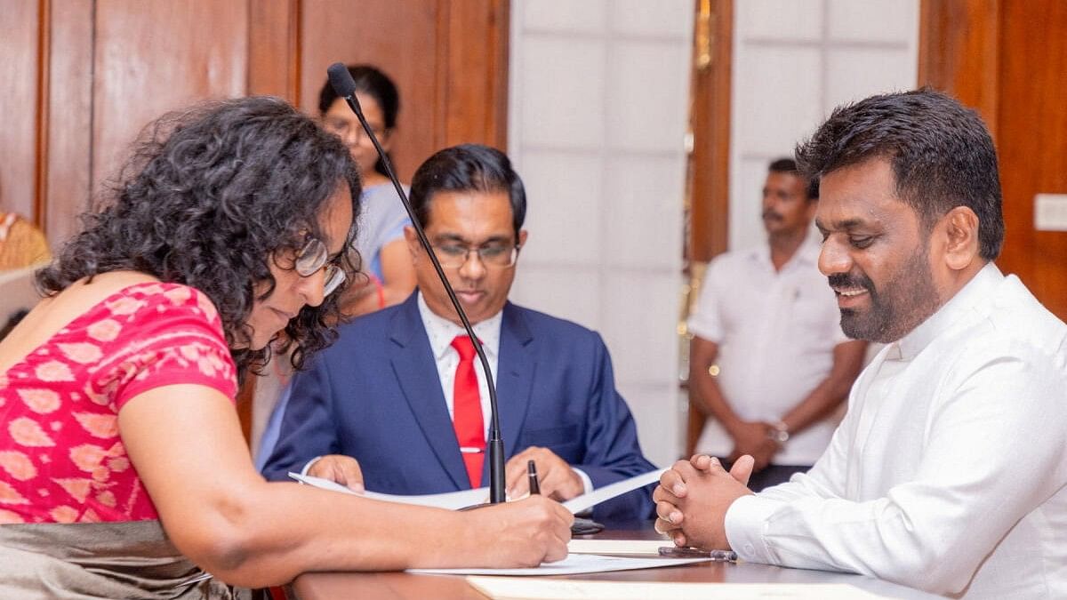 <div class="paragraphs"><p>Sri Lankan Prime Minister Harini Amarasuriya is seen with President Anura Kumara Dissanayake during her swearing-in ceremony, at the Presidential Secretariat, in Colombo, Sri Lanka.</p></div>