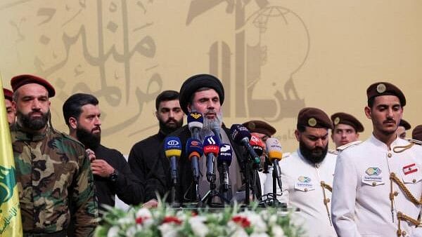 <div class="paragraphs"><p> Senior Hezbollah official Hashem Safieddine speaks during the funeral of Mohammed Nasser, a senior Hezbollah commander who was killed by what security sources say was an Israel strike on Wednesday, in Beirut's southern suburbs, Lebanon.&nbsp;</p></div>