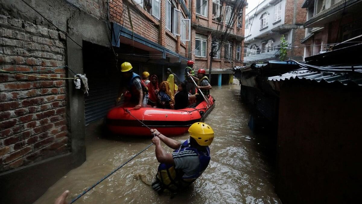 <div class="paragraphs"><p>Flood along the bank of overflowing Bagmati River following heavy rains in Kathmandu.</p></div>