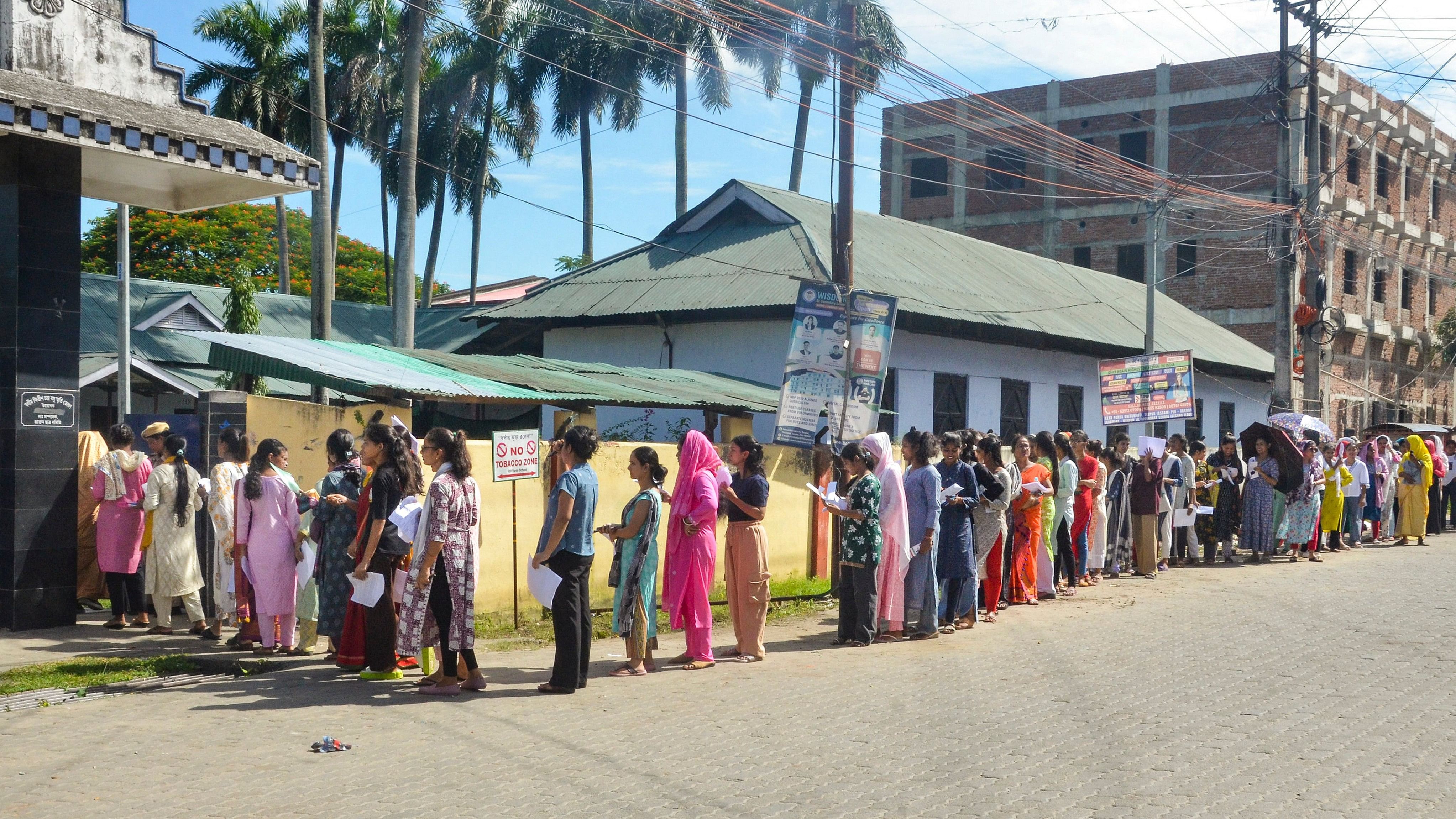 <div class="paragraphs"><p>Candidates wait in a queue as they arrive to appear for the Assam Direct Recruitment Examination (ADRE) Grade 3 exam, at an examination centre, in Tezpur of Sonitpur district, Assam.</p></div>