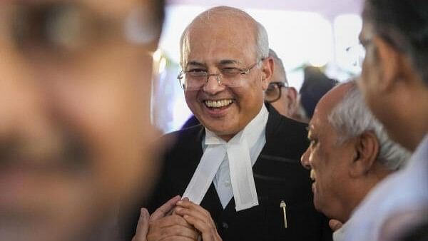 <div class="paragraphs"><p>Justice Manmohan being greeted by others after he took oath as the Chief Justice of the Delhi High Court during a ceremony at the Raj Niwas, in New Delhi, Sunday, Sept. 29</p></div>