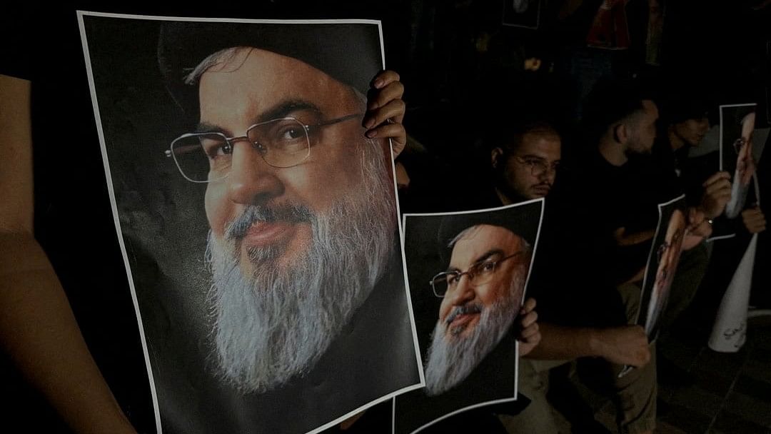 <div class="paragraphs"><p>Supporters of Lebanon's Hezbollah leader Sayyed Hassan Nasrallah carry his pictures as they gather in Sidon</p></div>