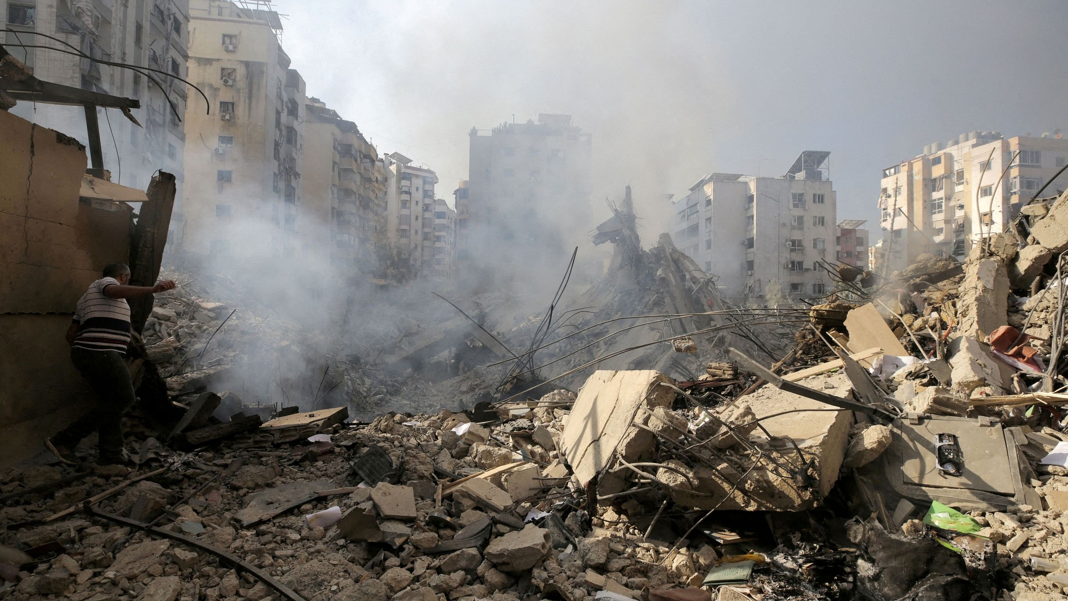 <div class="paragraphs"><p>A man walks on the rubble of damaged buildings in the aftermath of Israeli air strikes on Beirut's southern suburbs, Lebanon.</p></div>