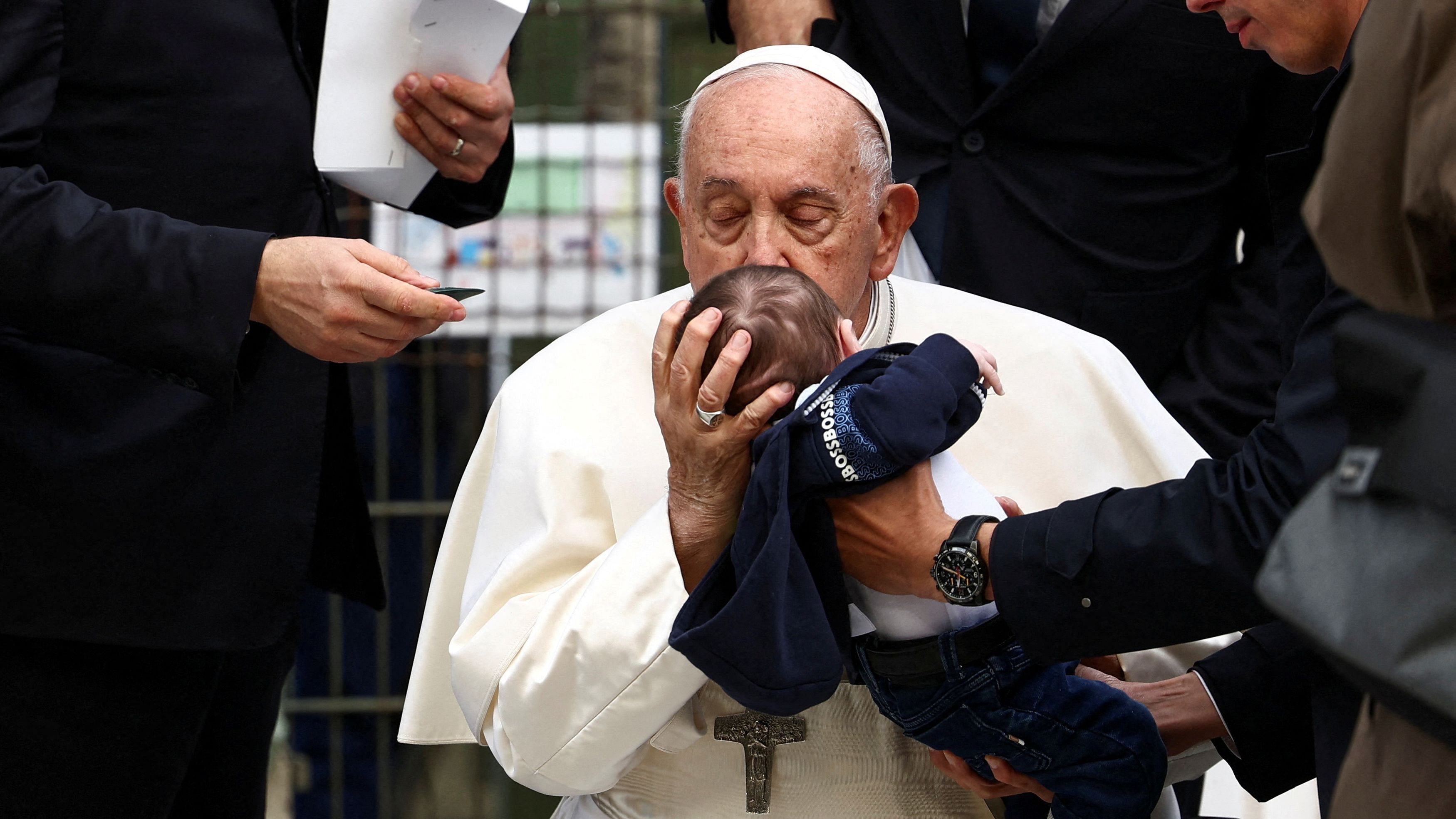 <div class="paragraphs"><p>Pope Francis kisses a baby after a Holy Mass at King Baudouin Stadium in Brussels, Belgium, September 29, 2024. </p></div>