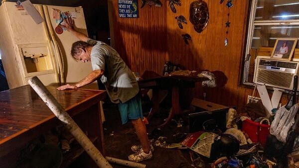 <div class="paragraphs"><p>Rex Liberman moves his refrigerator outside before emptying it as he cleans out his house after it was flooded by Hurricane Helene in Steinhatchee, Florida.&nbsp;</p></div>