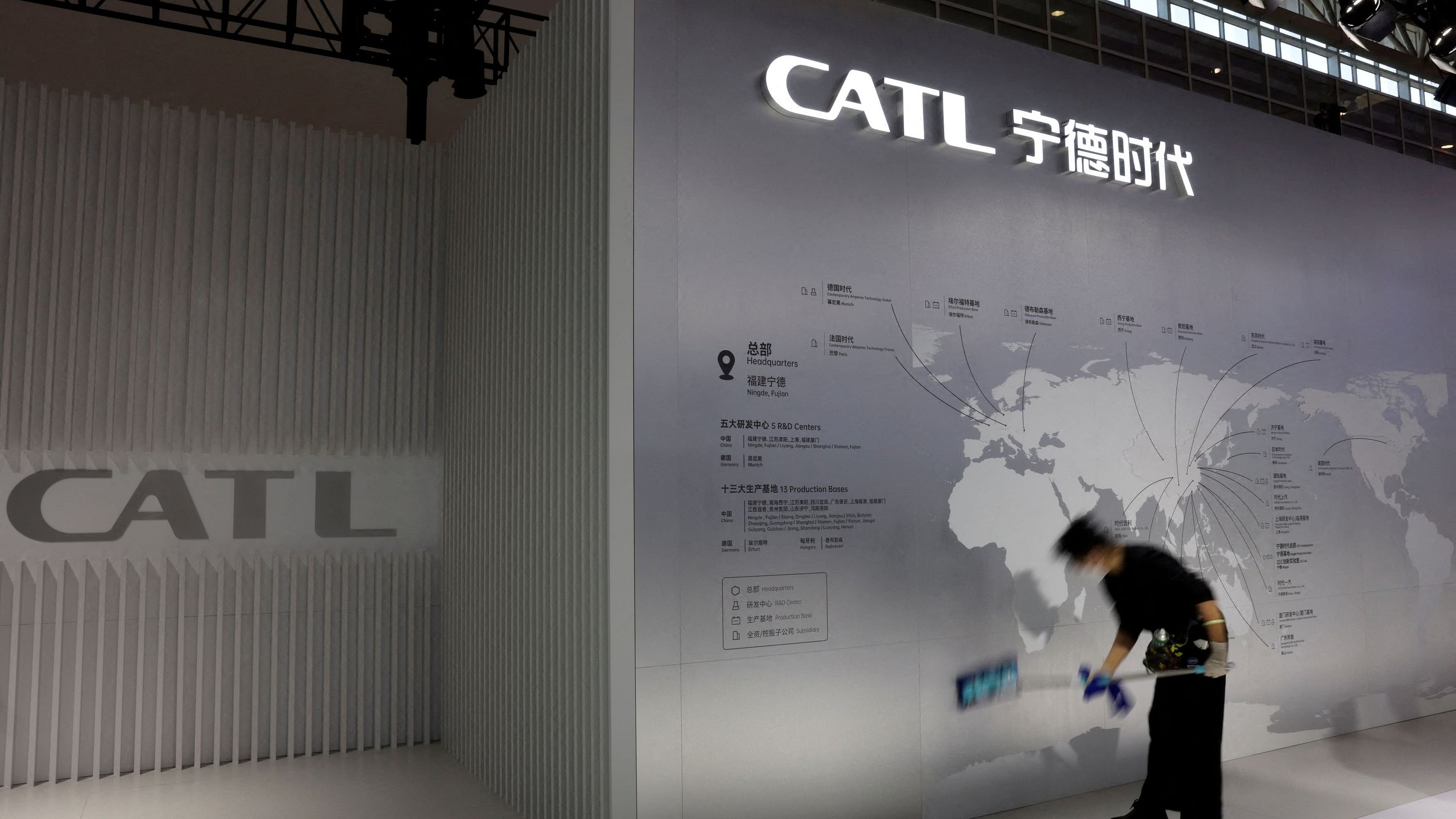 <div class="paragraphs"><p>A staff member cleans a display showing the locations of battery maker CATL's production bases, at the CATL booth during the first China International Supply Chain Expo  in Beijing, China.</p></div>