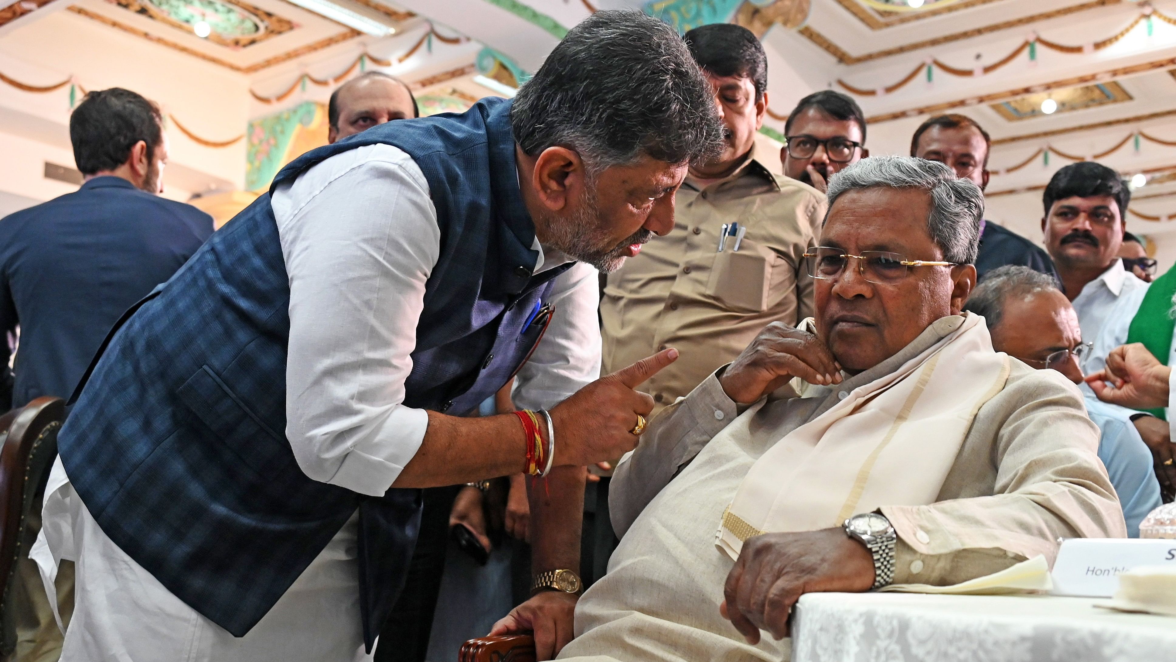 <div class="paragraphs"><p>Deputy Chief Minister DK Shivakumar interacts with Chief Minister Siddaramaiah, at Vidhana Soudha on Thursday.</p></div>