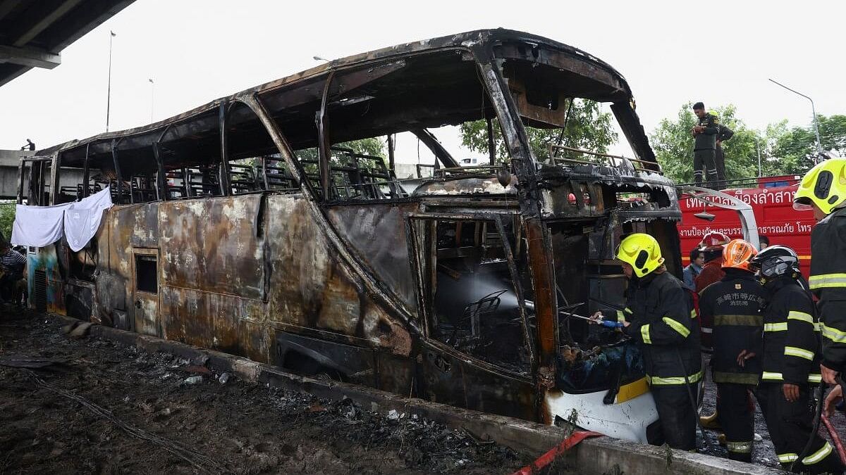 <div class="paragraphs"><p>Firefighters work to extinguish a burning bus that was carrying teachers and students from Wat Khao Phraya school in Bangkok.</p></div>