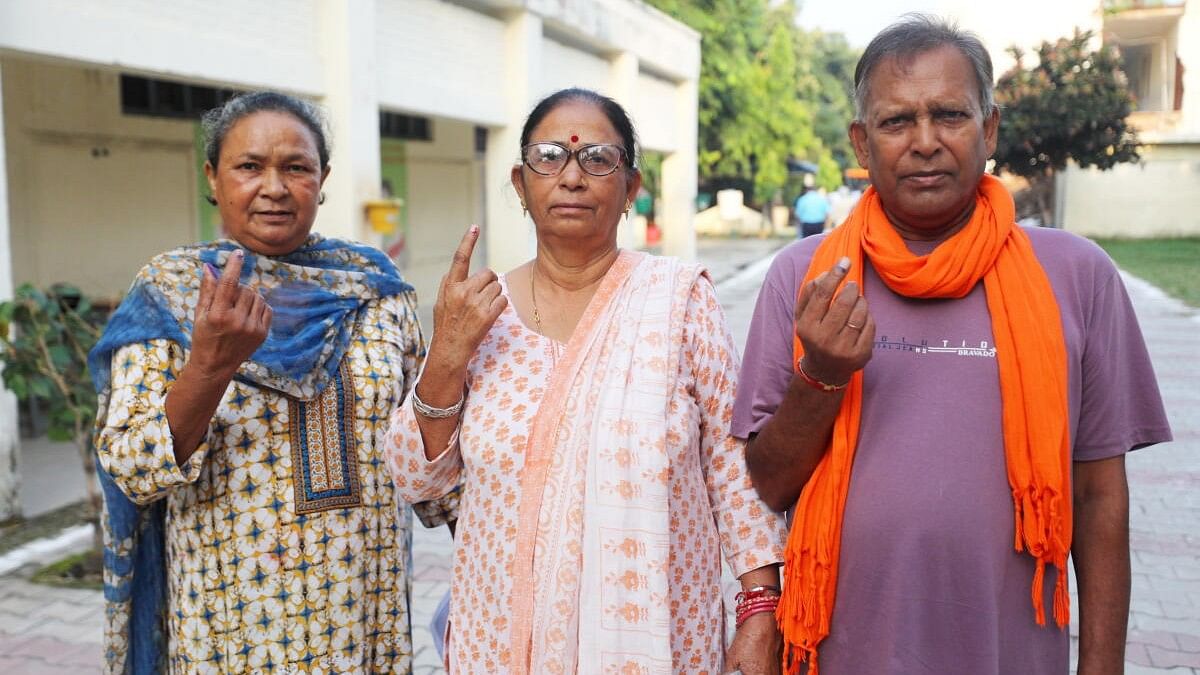 <div class="paragraphs"><p>People from the Valmiki community show their fingers marked with indelible ink after casting their votes during the third and final phase of Jammu &amp; Kashmir Assembly elections, at Gandhi Nagar in Jammu, J&amp;K.</p></div>