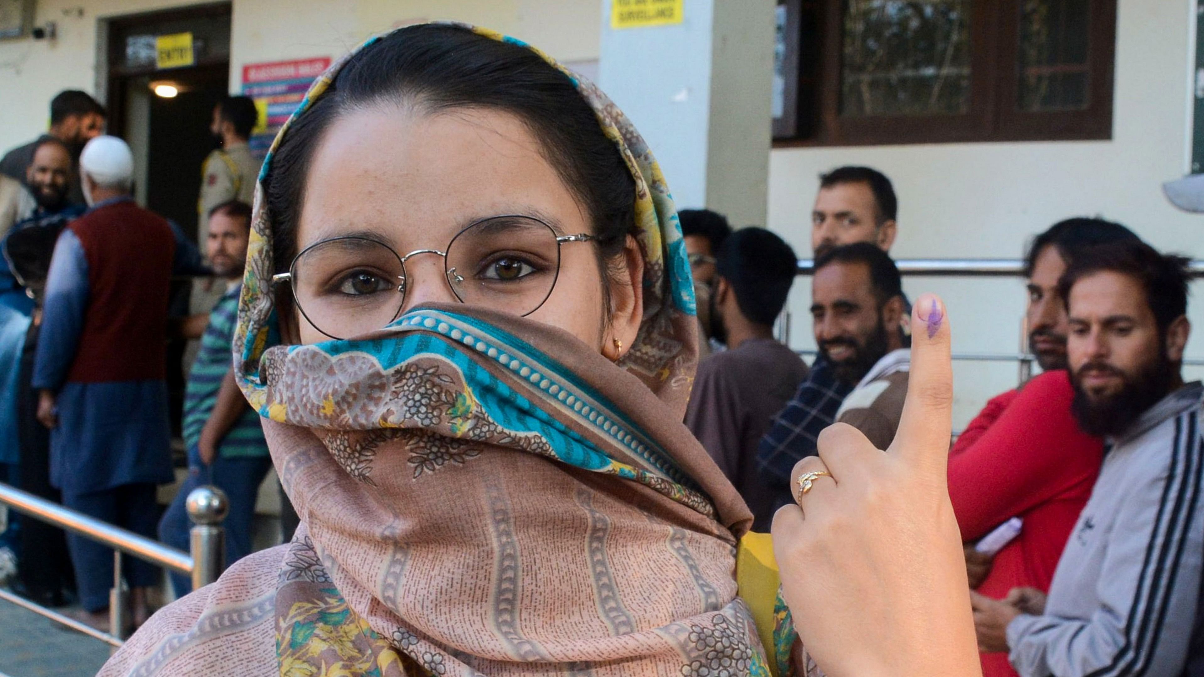 <div class="paragraphs"><p>A woman shows her inked finger after casting her vote at a polling booth during the third and final phase of Jammu &amp; Kashmir Assembly elections, at Tangmarg in Baramulla district.</p></div>