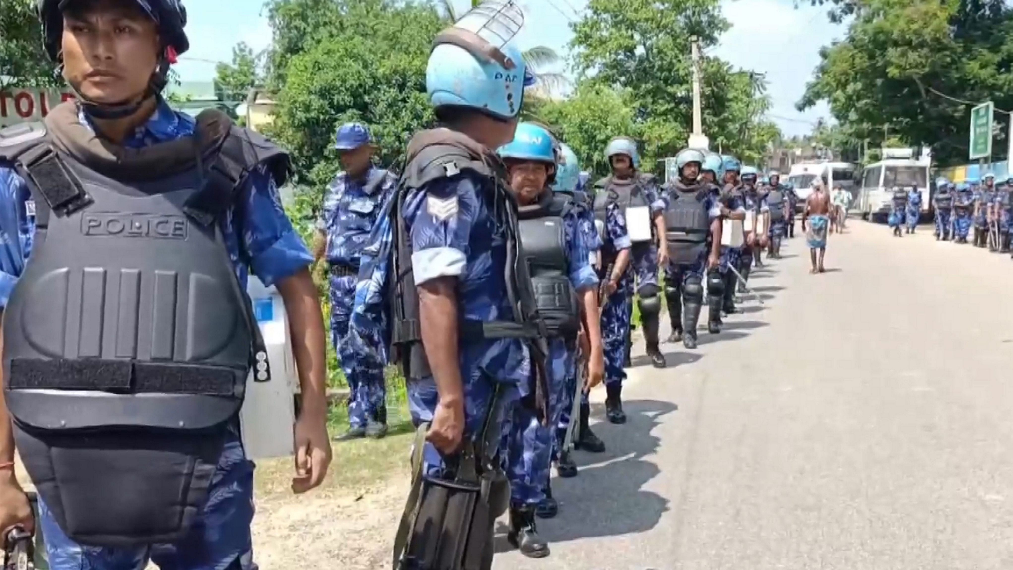 <div class="paragraphs"><p>Rapid Action Force personnel conduct a flag march amid controversial social media post uproar, in Bhadrak, Odisha.&nbsp;</p></div>