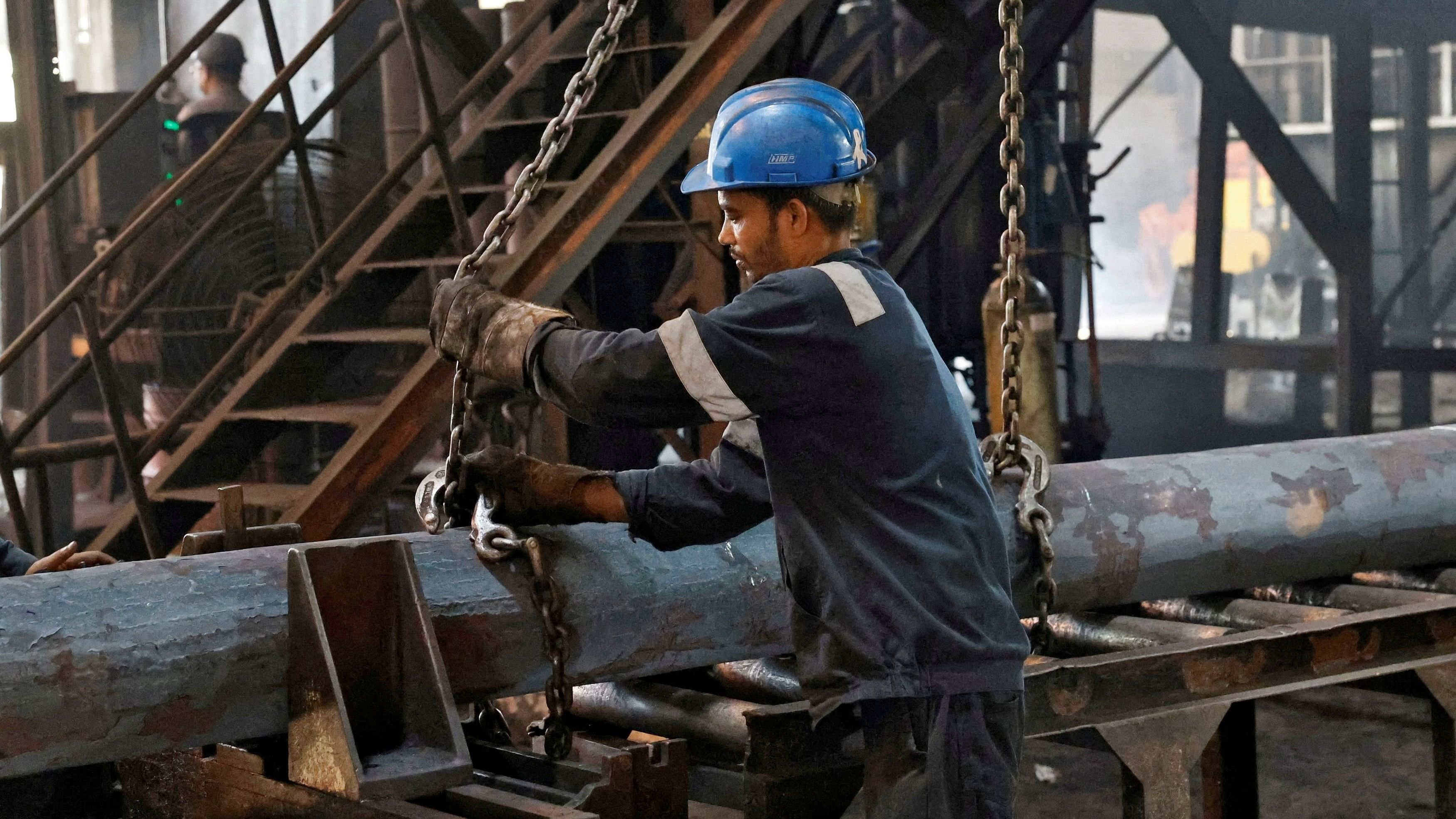 <div class="paragraphs"><p>FILE PHOTO: An employee prepares to move a heavy bar of steel inside the ArcVac ForgeCast factory, in Hooghly district, in the eastern state of West Bengal, India, April 26, 2024. </p></div>