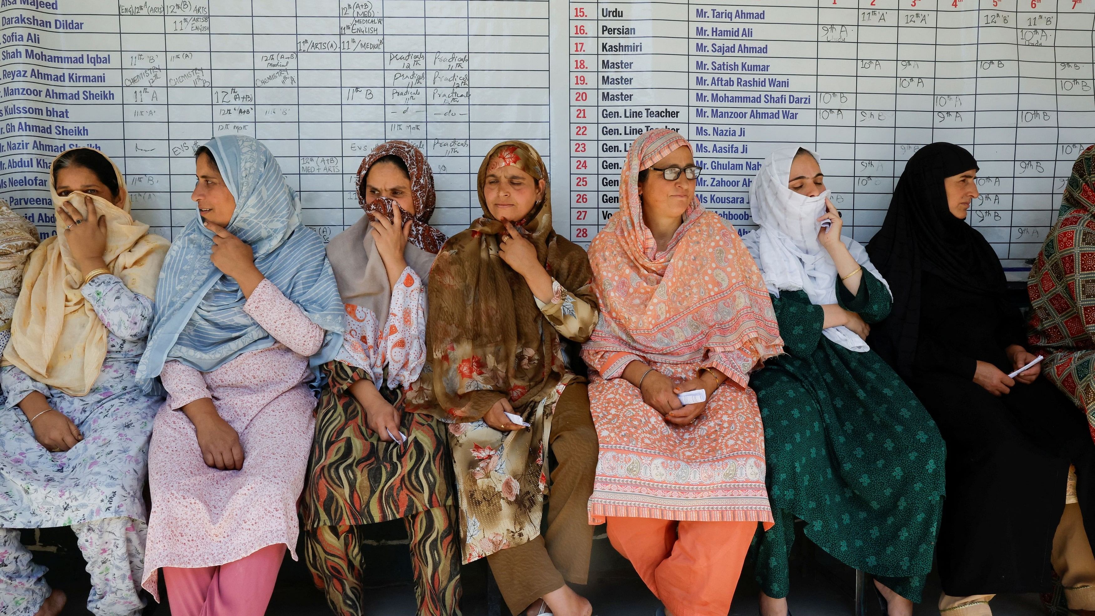 <div class="paragraphs"><p>Kashmiri women wait in queue to vote at a polling station, during the third and final phase of assembly elections, in North Kashmir's Handwara, October 1, 2024.</p></div>