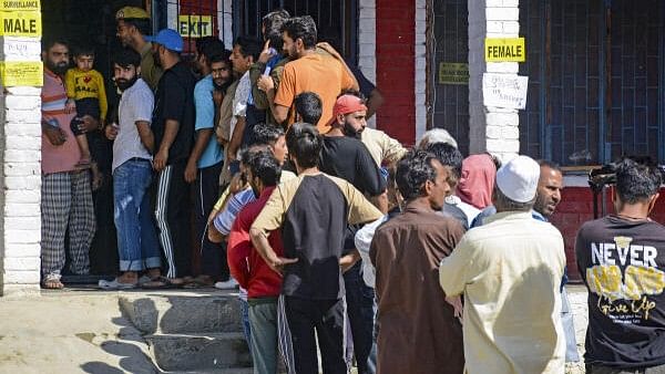 <div class="paragraphs"><p>Voters wait in a queue to cast their votes at a polling station during the third and final phase of the Jammu and Kashmir Assembly elections, in Bandipora district, Tuesday, Oct. 1, 2024. </p></div>