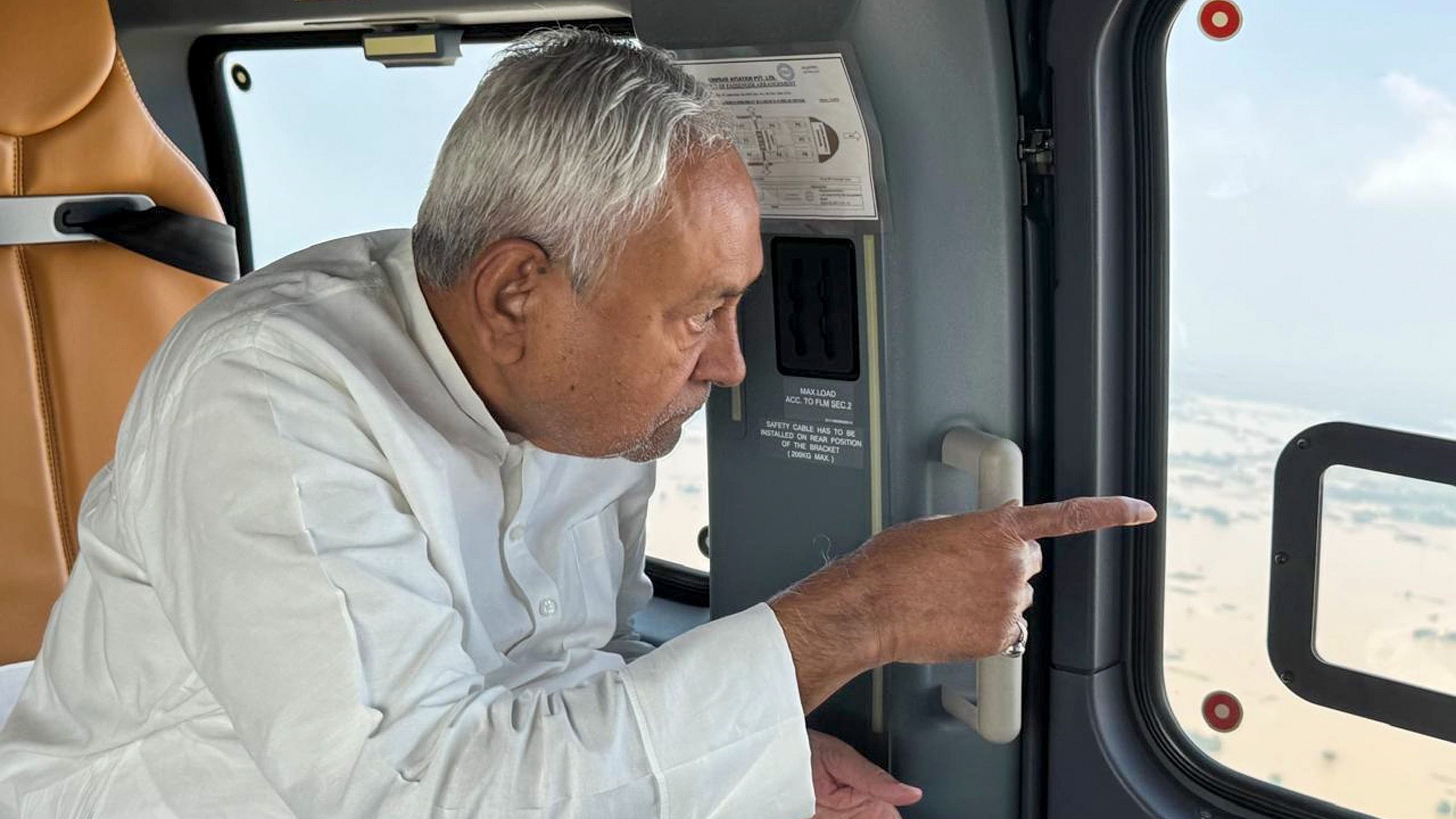 <div class="paragraphs"><p>Bihar Chief Minister Nitish Kumar conducts aerial survey of flood-affected areas of the state.</p></div>